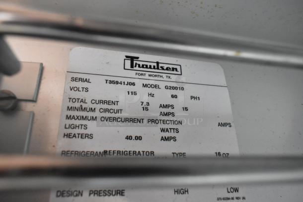 Traulsen G20010 cooler label showing specifications: 115 volts, 7.3 amps, 60 Hz, serial T35941J06.