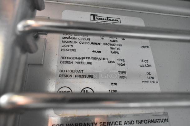 Traulsen G20010 stainless steel commercial cooler label, detailing electrical specs, refrigerant type, and design pressure.