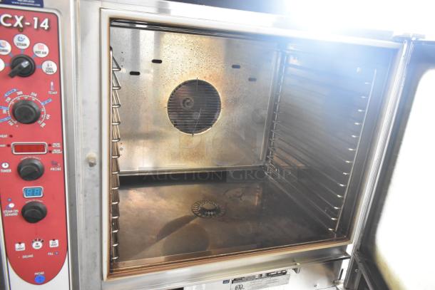 Blodgett BCX-14 commercial combi convection oven, stainless steel, view-through doors, metal racks, thermostatic controls visible.