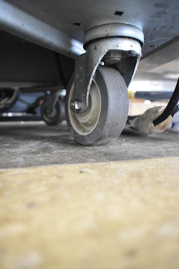 Vollrath 36150-00002-CNC buffet station caster, showcasing sturdy commercial-grade wheel and metal mount.