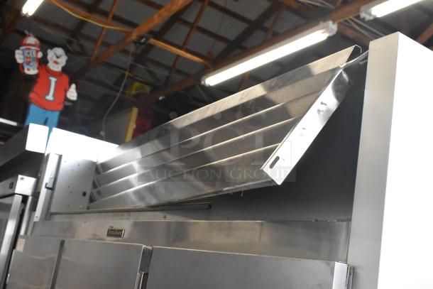 2016 Traulsen G31310 stainless steel commercial 3-door reach-in freezer, poly-coated racks; 115/208-230 volts, 1 phase.