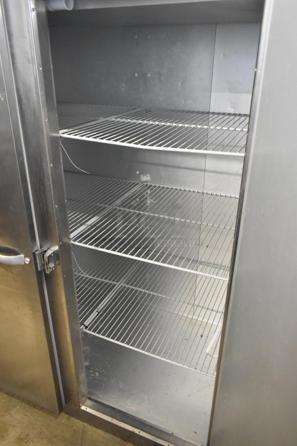 2016 Traulsen G31310 stainless steel 3-door commercial freezer with poly-coated racks, 115/208-230V, used condition.
