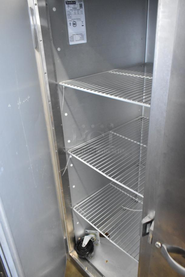 2016 Traulsen G31310 stainless steel commercial 3-door freezer, features poly-coated racks, 115/208-230V, 1 phase.