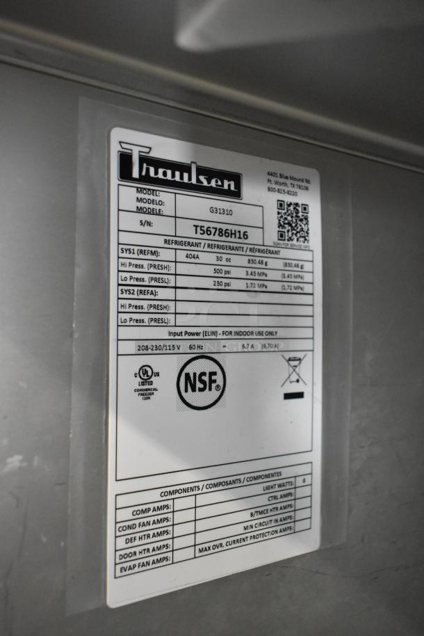 2016 Traulsen G31310 stainless steel 3-door freezer label showing model, serial number T56786H16, and NSF certification.