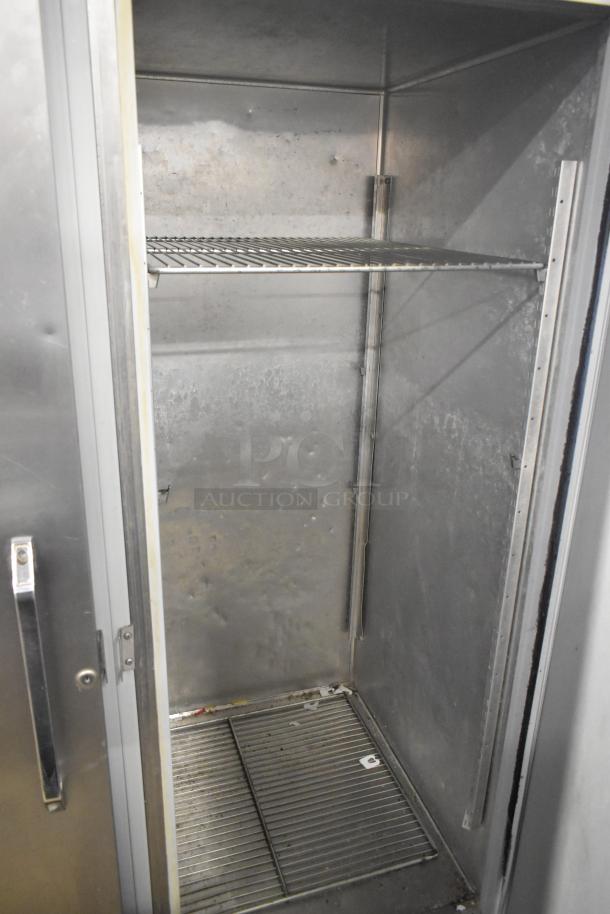 Hobart DAF3 stainless steel commercial 3-door freezer, poly-coated racks, used condition, 115/208-240 volts, 1 phase.