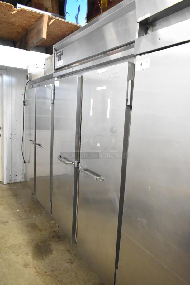 Continental DL2R-SA stainless steel commercial 2-door reach-in cooler, 115 volts, 1 phase, in used condition.