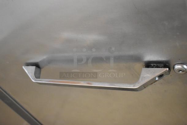 Continental DL2R-SA stainless steel 2-door commercial cooler handle, showing light wear, 115V, 1 phase.