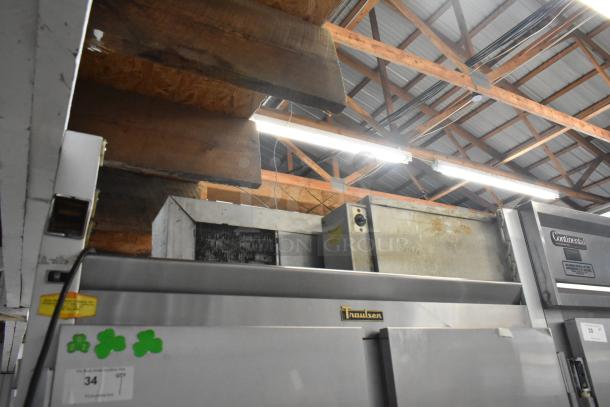 Traulsen G20010 stainless steel commercial 2-door reach-in cooler with poly-coated racks, 115 volts, 1 phase, visible branding.