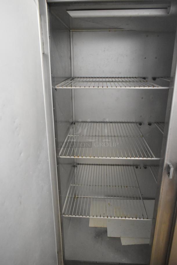 Traulsen G20010 stainless steel commercial 2-door cooler, poly coated racks, 115V, 1-phase, clean interior, used condition.