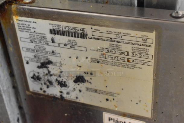 2019 Pitco Frialator 40D deep fryer label, indicating 107,000 BTU, natural gas, with clearance instructions. Slight wear visible.