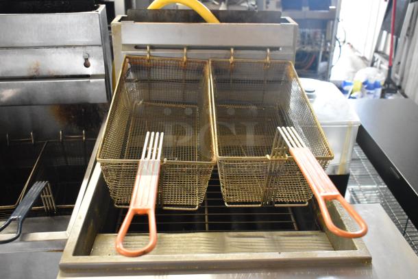 Sierra SRF-75/80-LP stainless steel commercial fryer, 80 lb capacity, 150,000 BTU, with two metal baskets, propane powered.