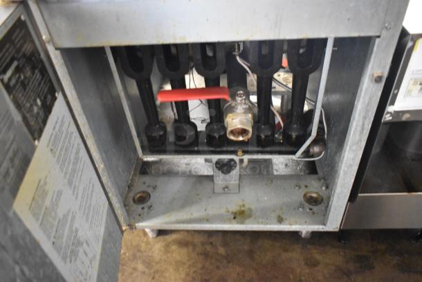 Sierra SRF-75/80-LP stainless steel 80 lb propane gas fryer, open front view, includes 2 metal baskets, 150,000 BTU.