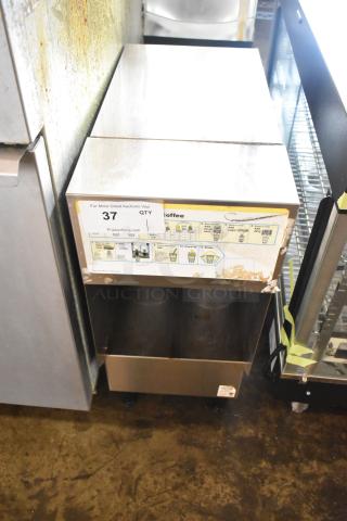 Bunn ICDD-3 stainless steel reservoir stand, features instructional label, good condition, minor cosmetic wear.