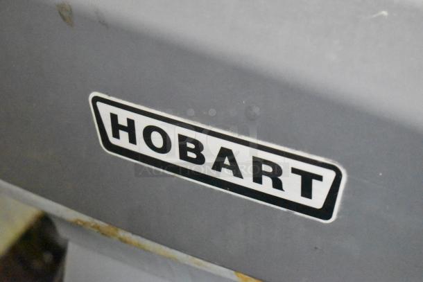 Hobart Legacy HL200 commercial mixer, metal, 20-quart, includes mixing bowl and whisk attachment. Visible Hobart logo.