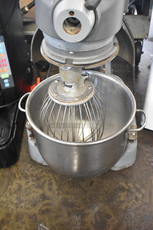 Hobart Legacy HL200 commercial 20-quart dough mixer with mixing bowl and whisk. Metal construction, 100-120V, 1 phase.