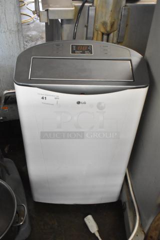 LG LP1415WXRSM Portable Air Conditioner, 14,000 BTU, 115 Volts, with digital display, in good condition.