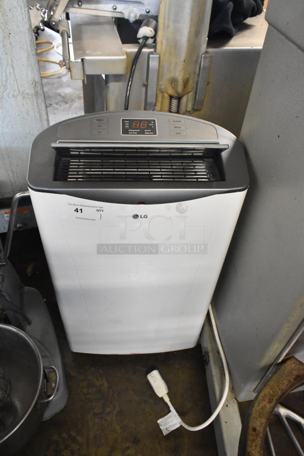 LG LP1415WXRSM Portable Air Conditioner, 14,000 BTU, 115 Volts, 1 Phase. Features control panel and LG branding.