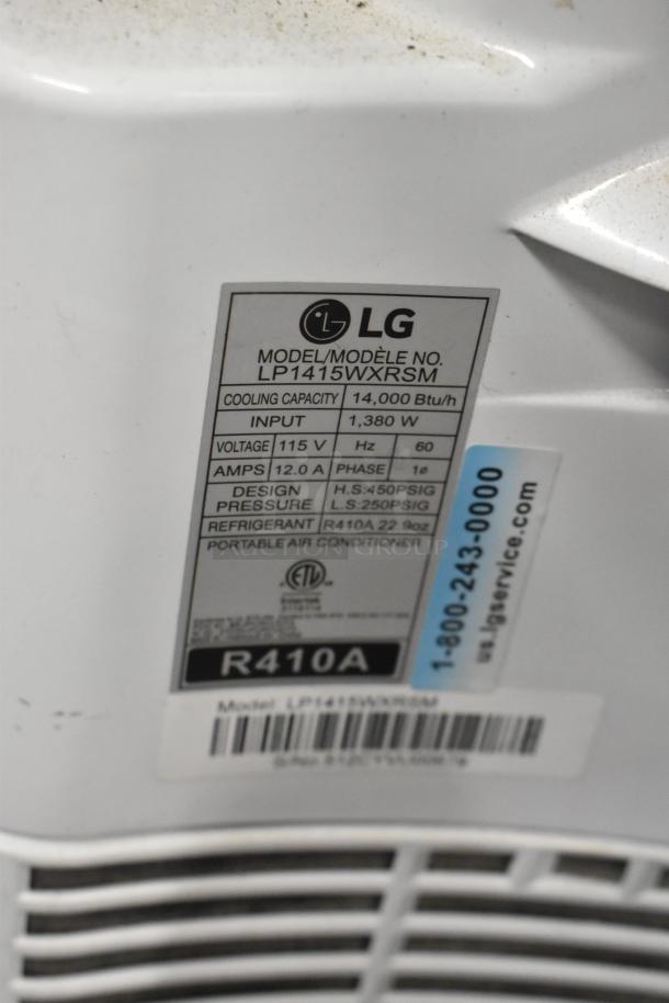 LG LP1415WXRSM Portable Air Conditioner, 14,000 BTU, 115V, 1 Phase. Features label with technical specs and R410A refrigerant.