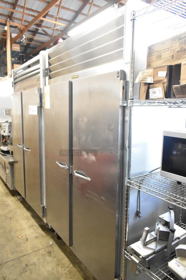 Traulsen G22010 stainless steel 2-door reach-in freezer, 115 volts, 1 phase, with poly-coated racks, in good condition.