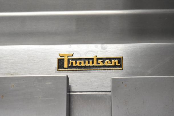 Traulsen G22010 stainless steel commercial 2-door reach-in freezer, featuring durable poly-coated racks and 115V, 1-phase power.