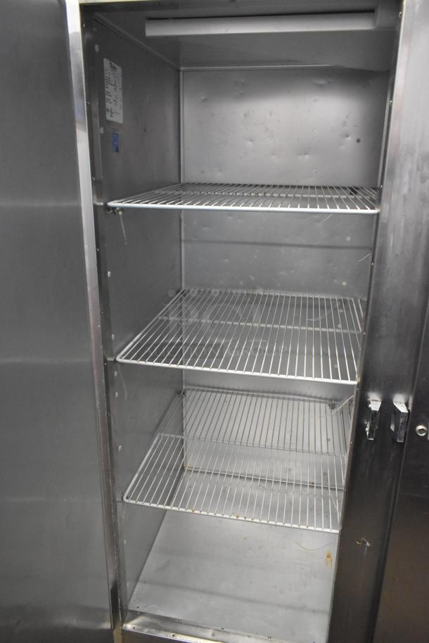 Traulsen G22010 stainless steel 2-door commercial freezer, features poly-coated racks, model number visible.