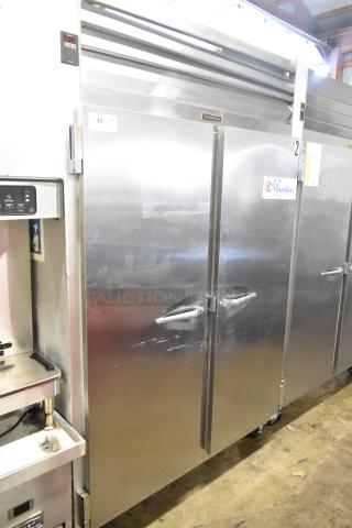 Traulsen G22010 Stainless Steel Commercial 2 Door Reach In Freezer w/ Poly Coated Racks on Commercial Casters. 115 Volts, 1 Phase. - Item #1218356
