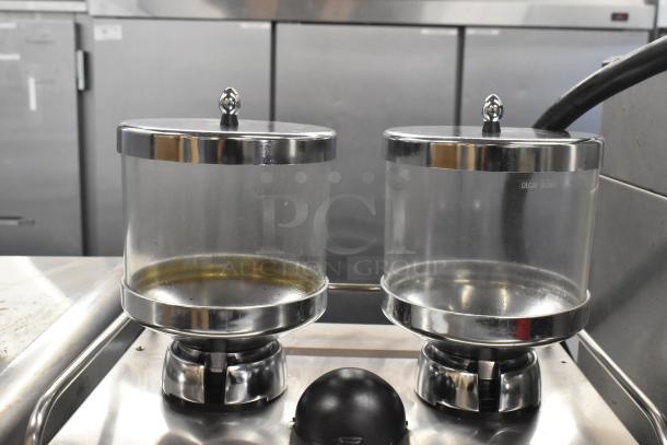 Schaerer Coffee Art Plus espresso machine with dual metal hoppers, visible "Decaf Beans" label, in clean condition.