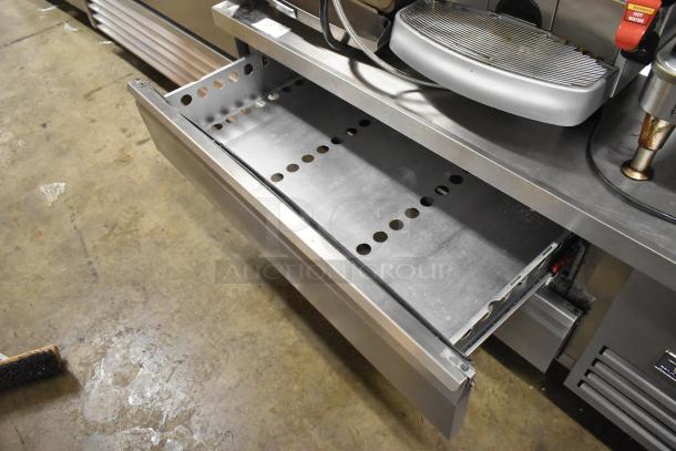 Arctic Air ARCB60CZ stainless steel 2-drawer chef base on commercial casters, shown with an open drawer. 115V, 1 phase.