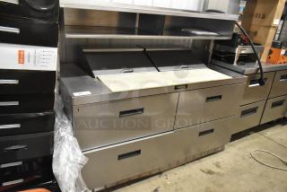 Delfield UCD4464N-12-DD5 stainless steel prep table with 4 drawers, over shelf, and bain marie top. 115V, 1 phase.