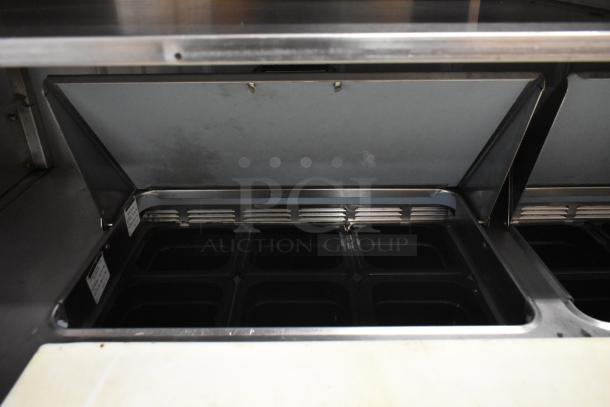 Delfield UCD4464N-12-DD5 stainless steel sandwich salad prep table, bain marie top, 4 drawers, over shelf, 115V, 1 phase.