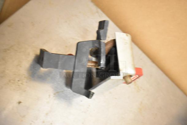 Berkel 827A metal commercial meat slicer with blade sharpener, 115 volts, 1 phase, on countertop.