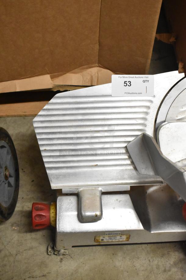 Berkel 827A metal commercial meat slicer with blade sharpener, 115 volts, 1 phase, visible wear, auction tag displaying "53".