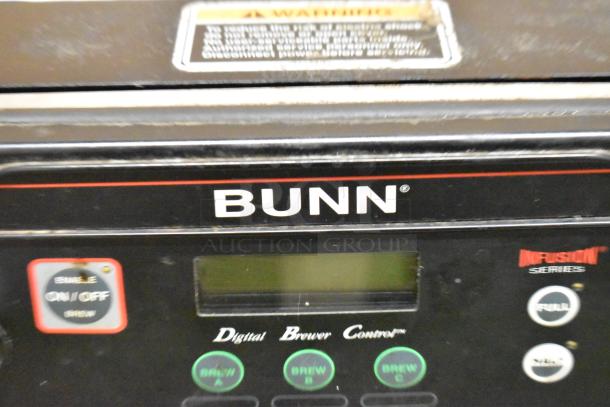 Bunn ITCB-DV stainless steel iced tea machine, featuring a hot water dispenser, poly brew basket, and digital controls.