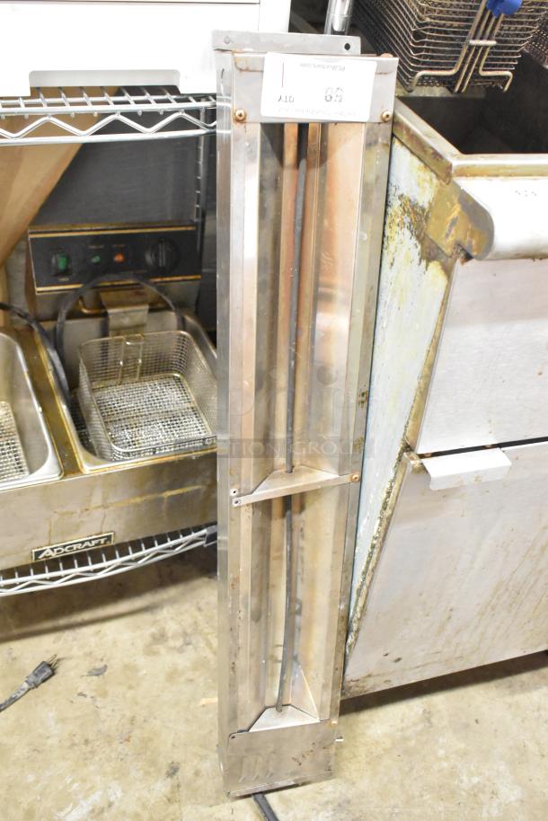 APW Wyott FD-60 metal commercial heat strip, 120V, 1 phase, in used condition, vertical placement, with visible power cord.