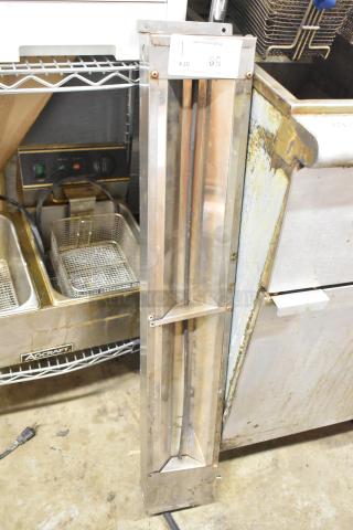 APW Wyott FD-60 metal commercial heat strip, 120V, 1 phase, in used condition, vertical placement, with visible power cord.