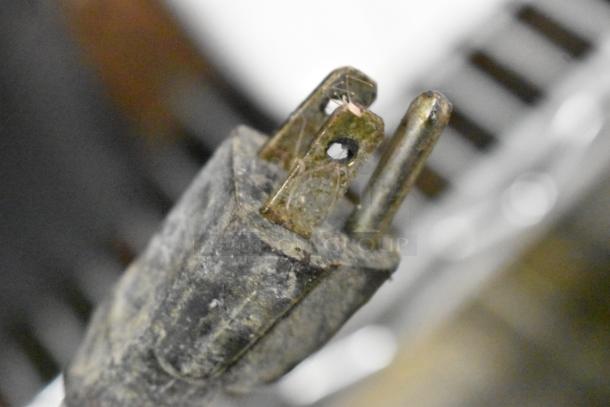 Adcraft electric fryer plug, showing slight wear. Stainless steel construction, suitable for commercial use, 120V, 1 phase.