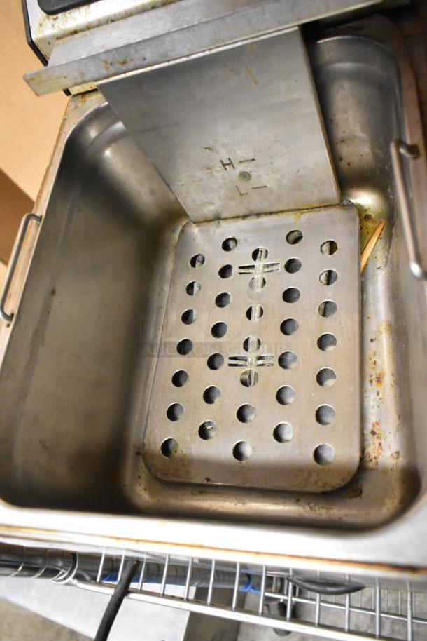 Adcraft stainless steel countertop electric deep fat fryer with two metal baskets. Visible wear. 120 volts, 1 phase.