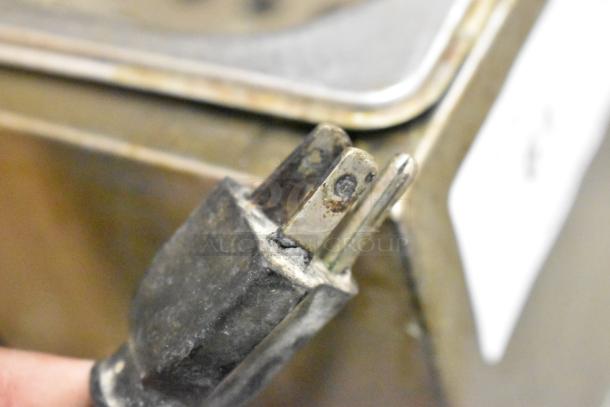 Adcraft stainless steel deep fat fryer, countertop model with two metal baskets, 120V, 1 phase; visible wear on plug.