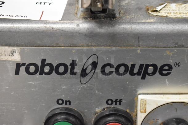 Robot Coupe R4N commercial food processor, metal body, on/off switches, visible wear, 220V, 3 phase.