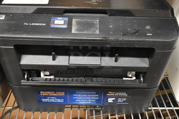 Brother HL-L2380DW printer, copier, fax machine; features touchscreen, WiFi, demo label; in good condition; versatile use.