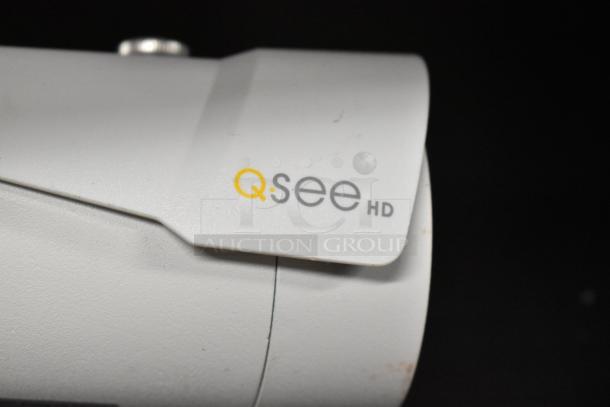 Qsee QCA8075B HD security camera, white finish, close-up showing logo and condition.