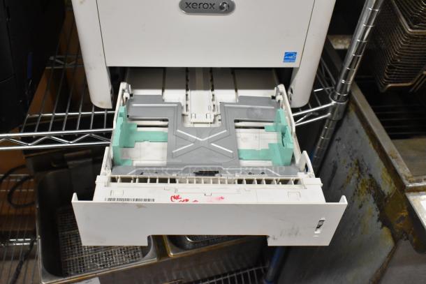 Xerox WorkCentre 3345 printer copier, open paper tray, moderate wear, small label on tray, suitable for office use.