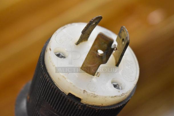 Close-up of power plug for Blodgett UCI/AA heated holding case, showing prongs and 250V marking, indicating voltage compatibility.