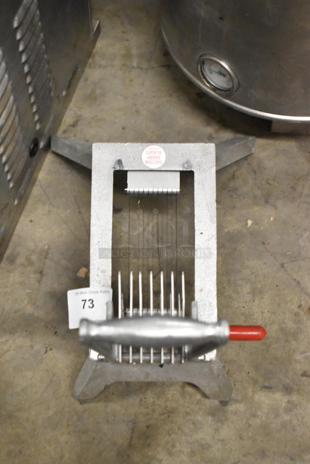 Vollrath Metal Countertop Onion King Slicer, sturdy construction, sharp blades, labeled "Caution: Sharp Blades," in used condition.