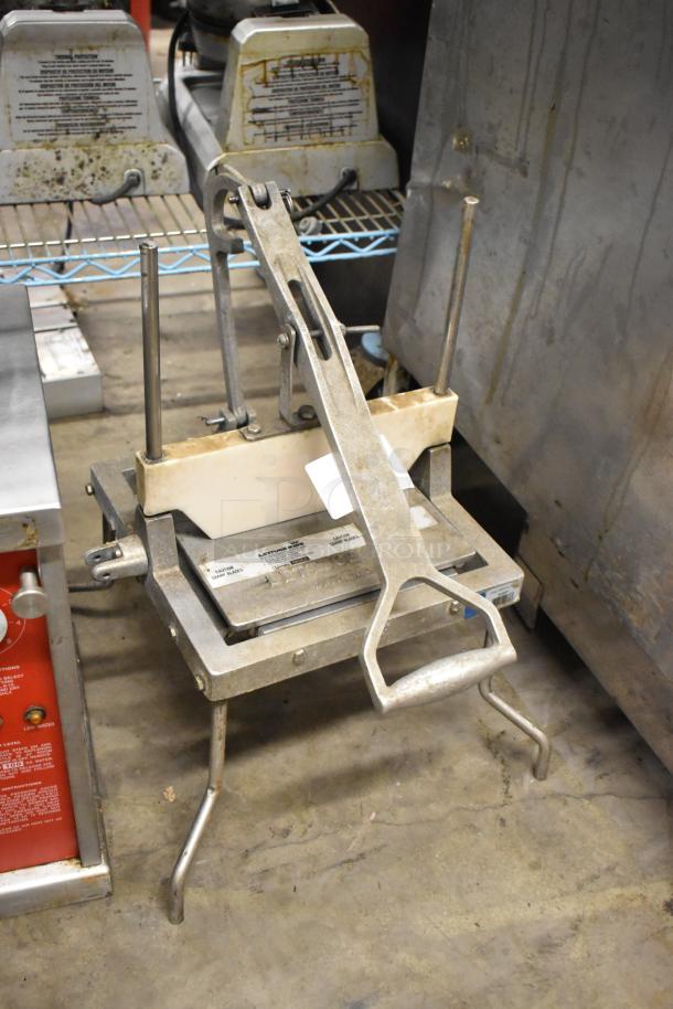 Metal Countertop Lettuce Head Cutter with robust lever mechanism, showing signs of use, sturdy metal construction.