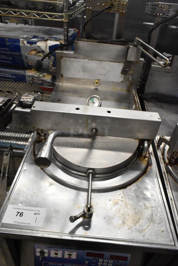 Broaster 1800GH stainless steel commercial pressure fryer, floor style, natural gas powered, 65,000 BTU. Visible wear.