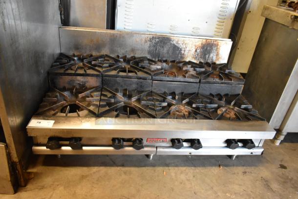 Vulcan commercial gas range, stainless steel, 2-tier, 8 burners, good condition, visible wear. Model label: Vulcan.