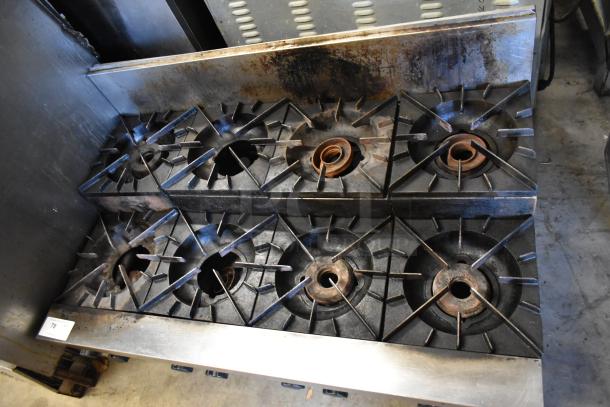 Vulcan stainless steel 8 burner gas range, 2-tier, commercial countertop model. Visible wear on burners. Tag reads "78".