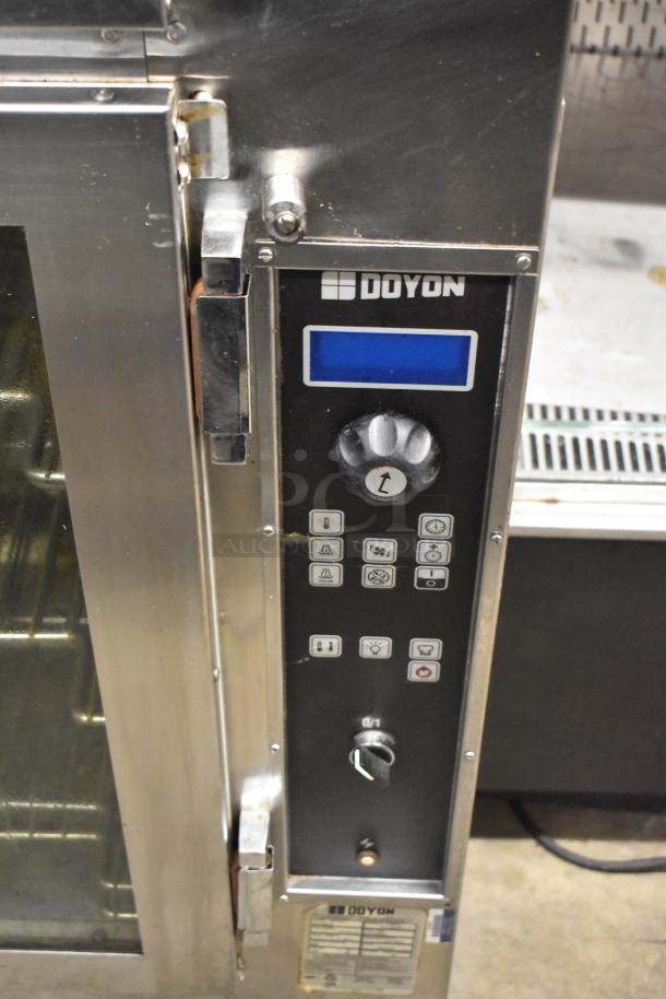 Doyon JA12SLG stainless steel commercial oven proofer, natural gas powered, 130,000 BTU, control panel with brand logo.