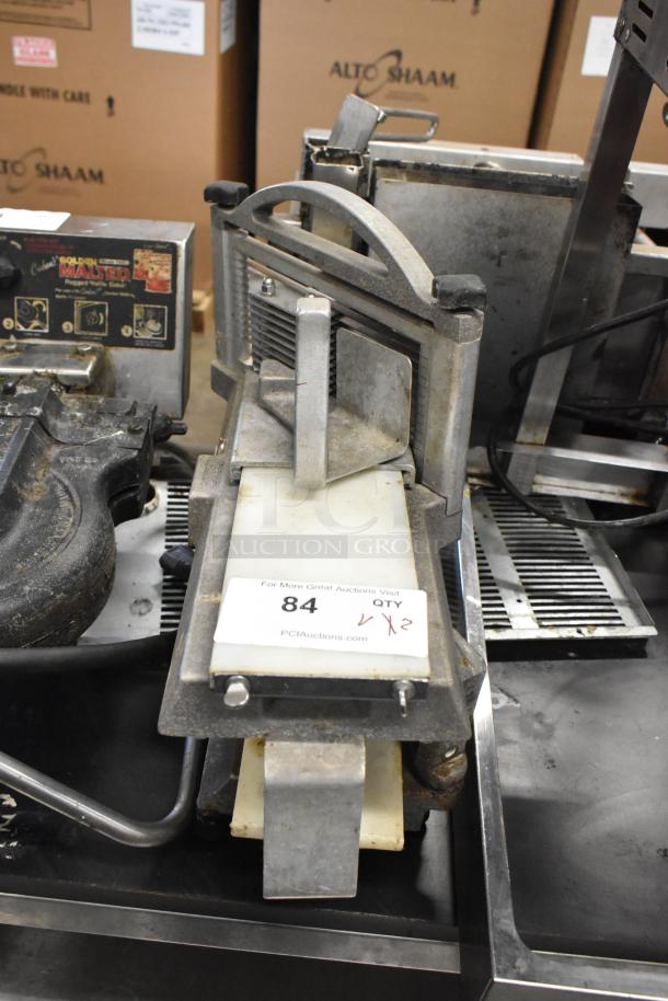 Nemco Tomato Slicer, used condition, metal construction. Includes auction tag indicating lot 84, quantity x2.